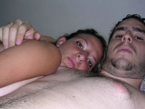 A tanned brunette shines her tits in the morning in bed. Thumbnail 29