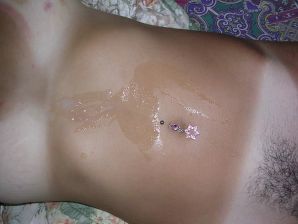A tanned brunette shines her tits in the morning in bed. Thumbnail 30
