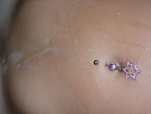A tanned brunette shines her tits in the morning in bed. Thumbnail 31
