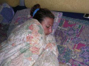 A tanned brunette shines her tits in the morning in bed. Thumbnail 8