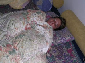 A tanned brunette shines her tits in the morning in bed. Thumbnail 9