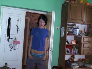 A tanned girl is spinning naked in a room. Thumbnail 4