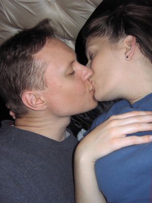 A mature woman posing in a transparent dress in front of a man. Thumbnail 11