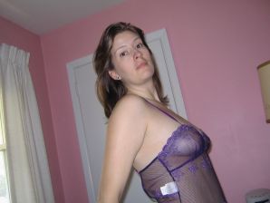 A mature woman posing in a transparent dress in front of a man. Thumbnail 26