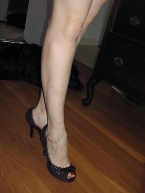 A mature woman posing in a transparent dress in front of a man. Thumbnail 28