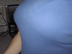 A mature woman posing in a transparent dress in front of a man. Thumbnail 3