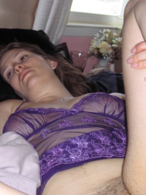 A mature woman posing in a transparent dress in front of a man. Thumbnail 39