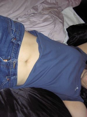 A mature woman posing in a transparent dress in front of a man. Thumbnail 5