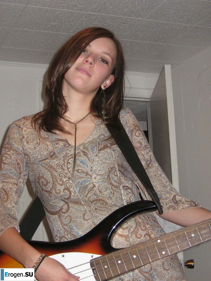A naked chick poses with a guitar, and a guy licks her. Slide 6