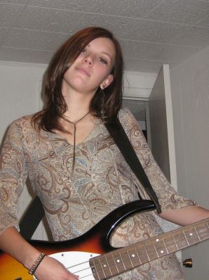 A naked chick poses with a guitar, and a guy licks her. Thumbnail 6