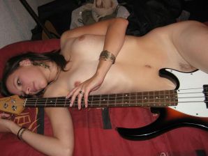 A naked chick poses with a guitar, and a guy licks her. Thumbnail 8