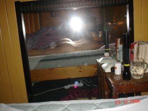 A blue-eyed minx with a pierced nipple plays with her panties. Thumbnail 10
