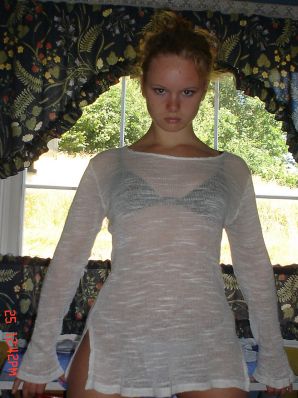A blue-eyed minx with a pierced nipple plays with her panties. Thumbnail 17