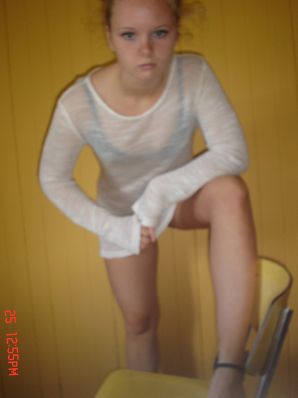 A blue-eyed minx with a pierced nipple plays with her panties. Thumbnail 24
