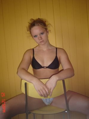 A blue-eyed minx with a pierced nipple plays with her panties. Thumbnail 25