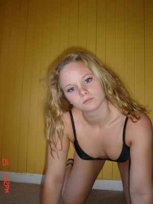 A blue-eyed minx with a pierced nipple plays with her panties. Thumbnail 28