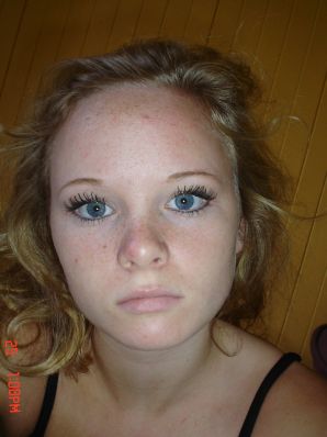 A blue-eyed minx with a pierced nipple plays with her panties. Thumbnail 31
