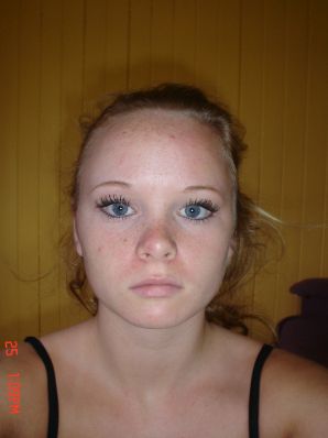A blue-eyed minx with a pierced nipple plays with her panties. Thumbnail 32