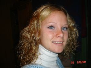 A blue-eyed minx with a pierced nipple plays with her panties. Thumbnail 39