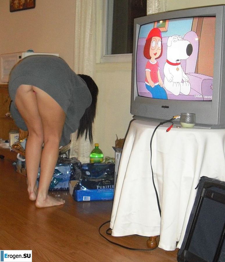 Charming woman posing in fishnet tights on an elastic ass. Slide 1