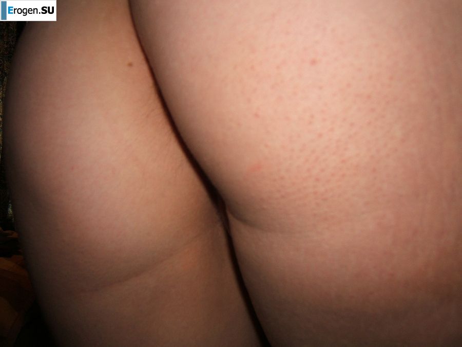 A slender blonde spreads her labia with her fingers. Slide 9