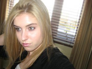 Chic blonde poses without a bra in the bathroom in front of the mirror. Thumbnail 3