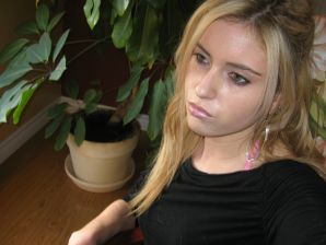 Chic blonde poses without a bra in the bathroom in front of the mirror. Thumbnail 6