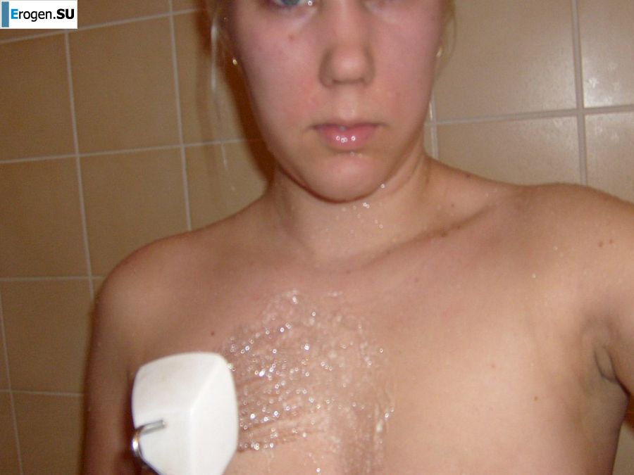 The blonde opened her labia and showed a wet vagina. Slide 2