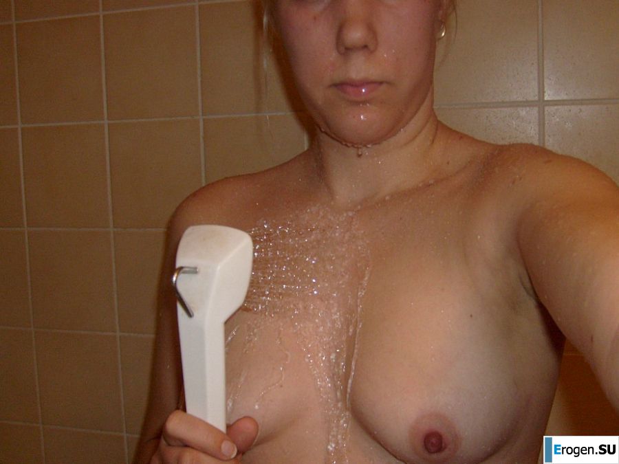 The blonde opened her labia and showed a wet vagina. Slide 4