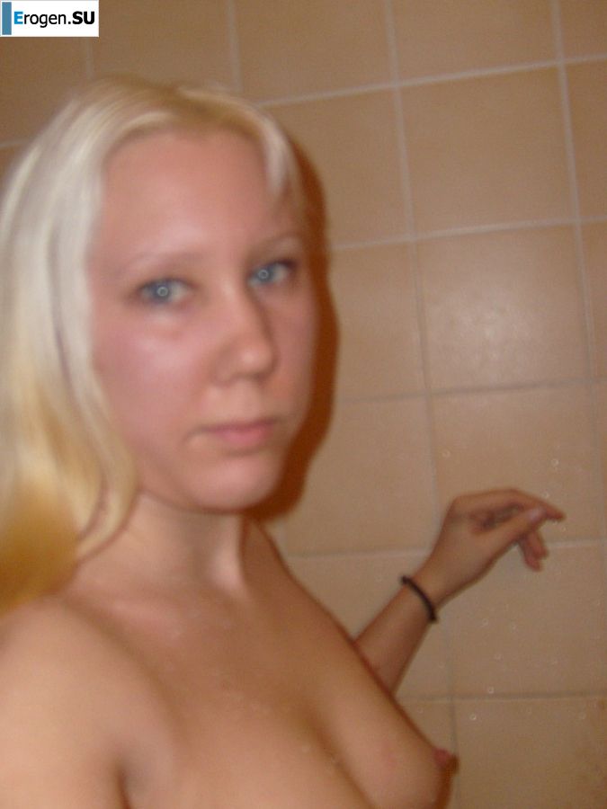 The blonde opened her labia and showed a wet vagina. Slide 5
