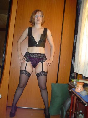 A red-haired student with glasses spread her legs in lace stockings and showed a pussy. Thumbnail 10