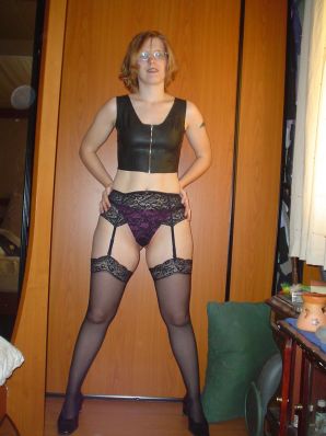 A red-haired student with glasses spread her legs in lace stockings and showed a pussy. Thumbnail 9
