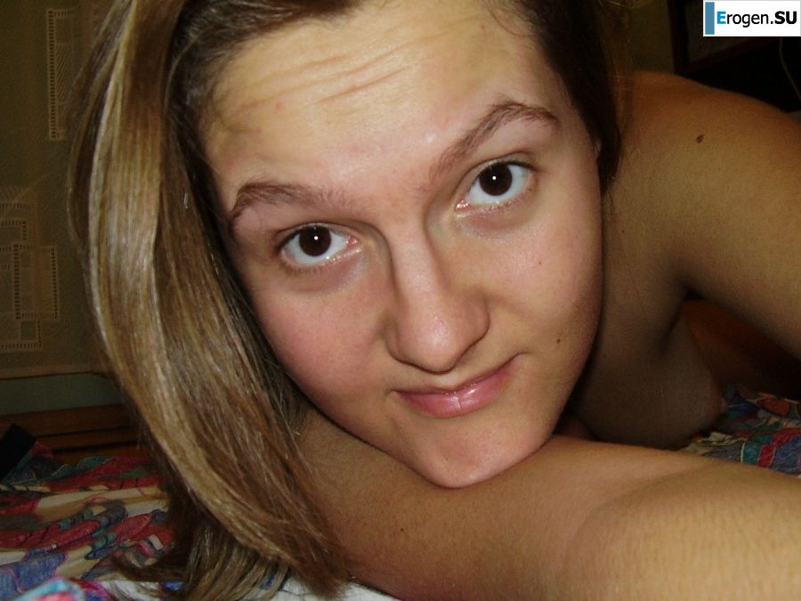 Sexy girl posing on the beach in shorts without a bra. Slide 15