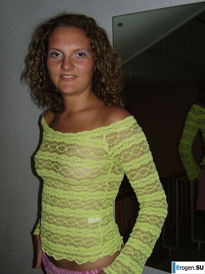 Sexy girl posing on the beach in shorts without a bra. Slide 6