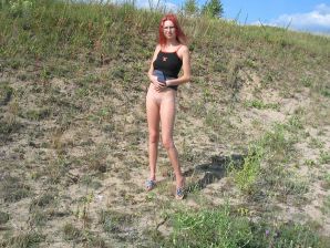 The red-haired beauty with a shaved pussy poses in one jacket. Thumbnail 27