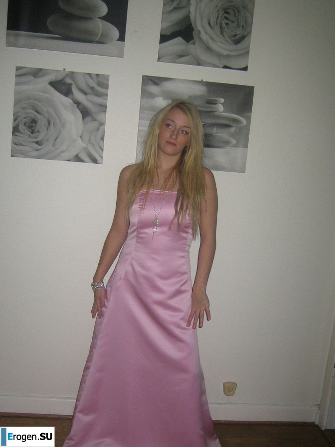 A blonde with silicone breast poses in a short skirt. Slide 16