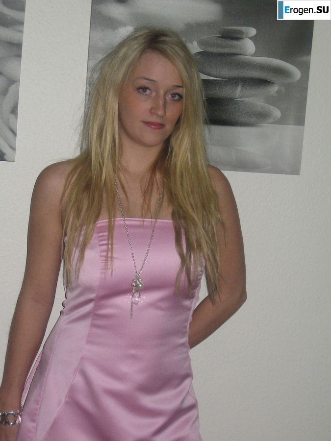 A blonde with silicone breast poses in a short skirt. Slide 17