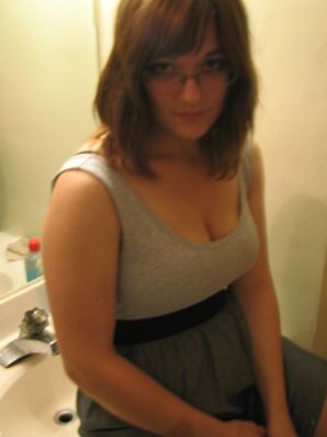 A girl with large breasts poses in clothes and then undresses. Part 2. Thumbnail 13