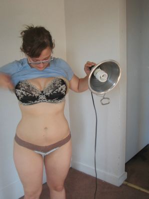 A girl with large breasts poses in clothes and then undresses. Part 2. Thumbnail 2