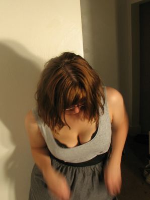 A girl with large breasts poses in clothes and then undresses. Part 2. Thumbnail 25