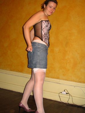 A young woman shows her ass and legs in white stockings. Thumbnail 23