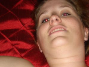 The seductive female is naked and shows a striptease, spreading her legs. Thumbnail 2