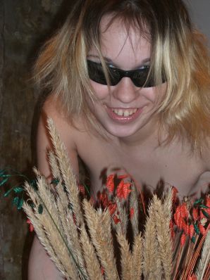 A blonde with a thin waist poses in glasses and red panties. Part 2. Thumbnail 12
