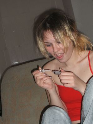 A blonde with a thin waist poses in glasses and red panties. Part 2. Thumbnail 16
