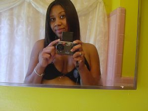 The mulatto pulls her boobs, and then spreads her legs. Thumbnail 22