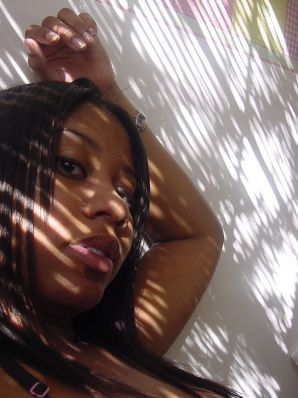 The mulatto pulls her boobs, and then spreads her legs. Thumbnail 28