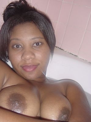 The mulatto pulls her boobs, and then spreads her legs. Thumbnail 38