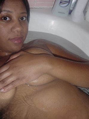 The mulatto pulls her boobs, and then spreads her legs. Thumbnail 39
