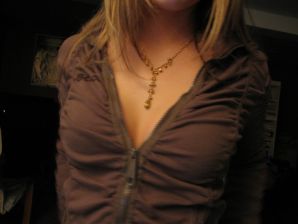 Charming blonde pulled down her blouse and bared boobs. Thumbnail 2