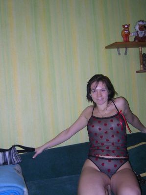 A naughty brunette with small breasts poses at the mirror. Thumbnail 4